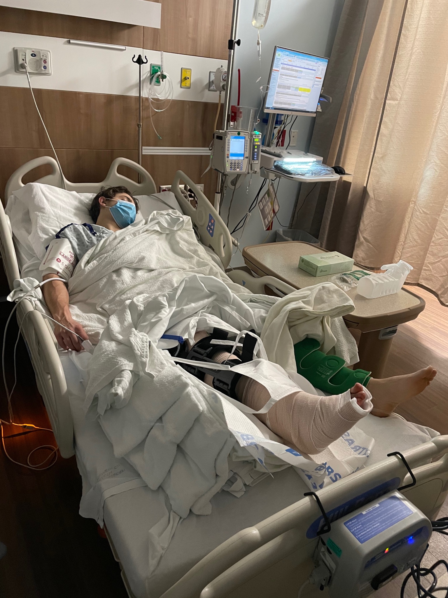 Mark in the hospital during recovery from his leg injury