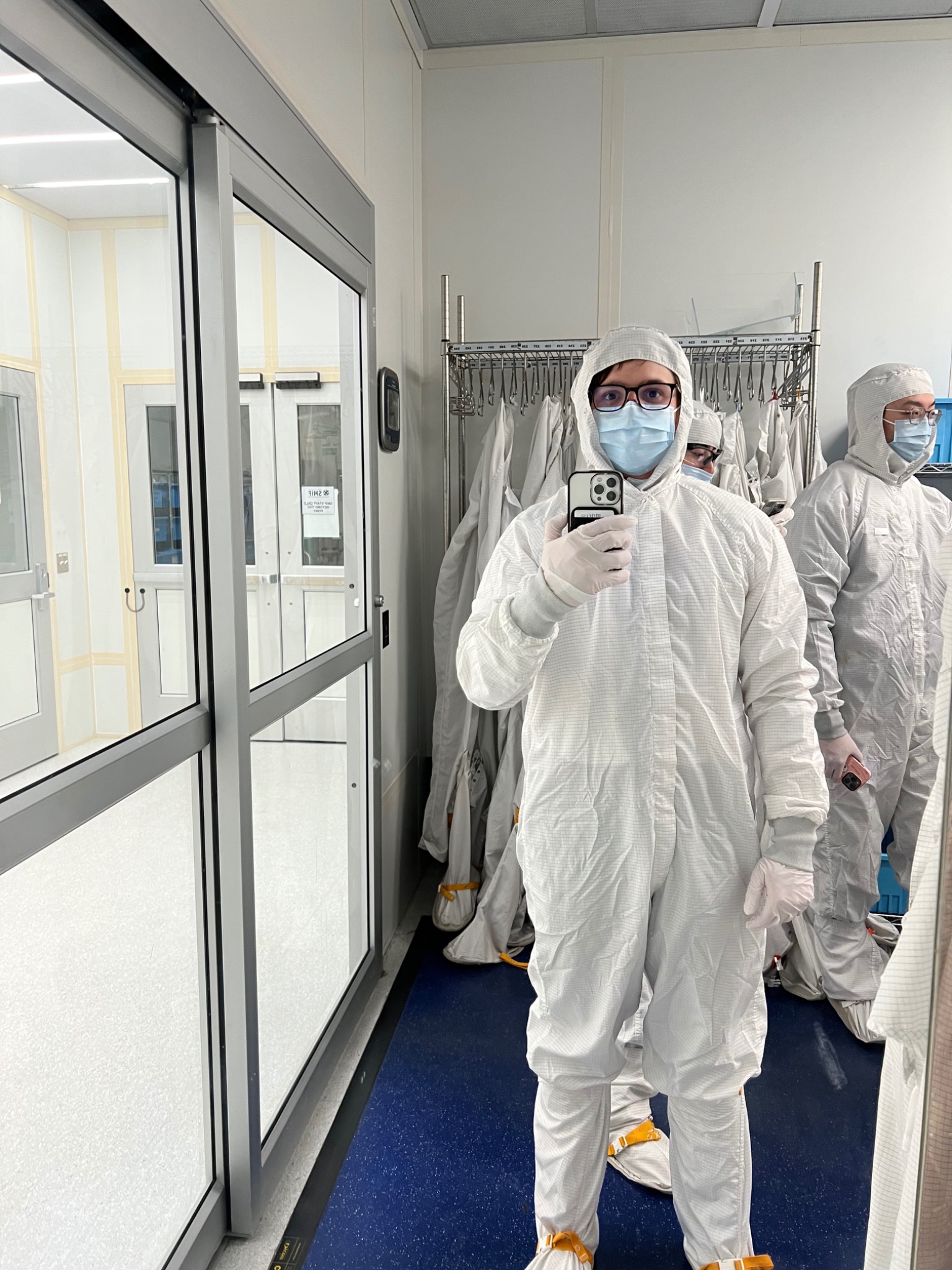 Mark wearing protective cleanroom attire at Duke SMIF
